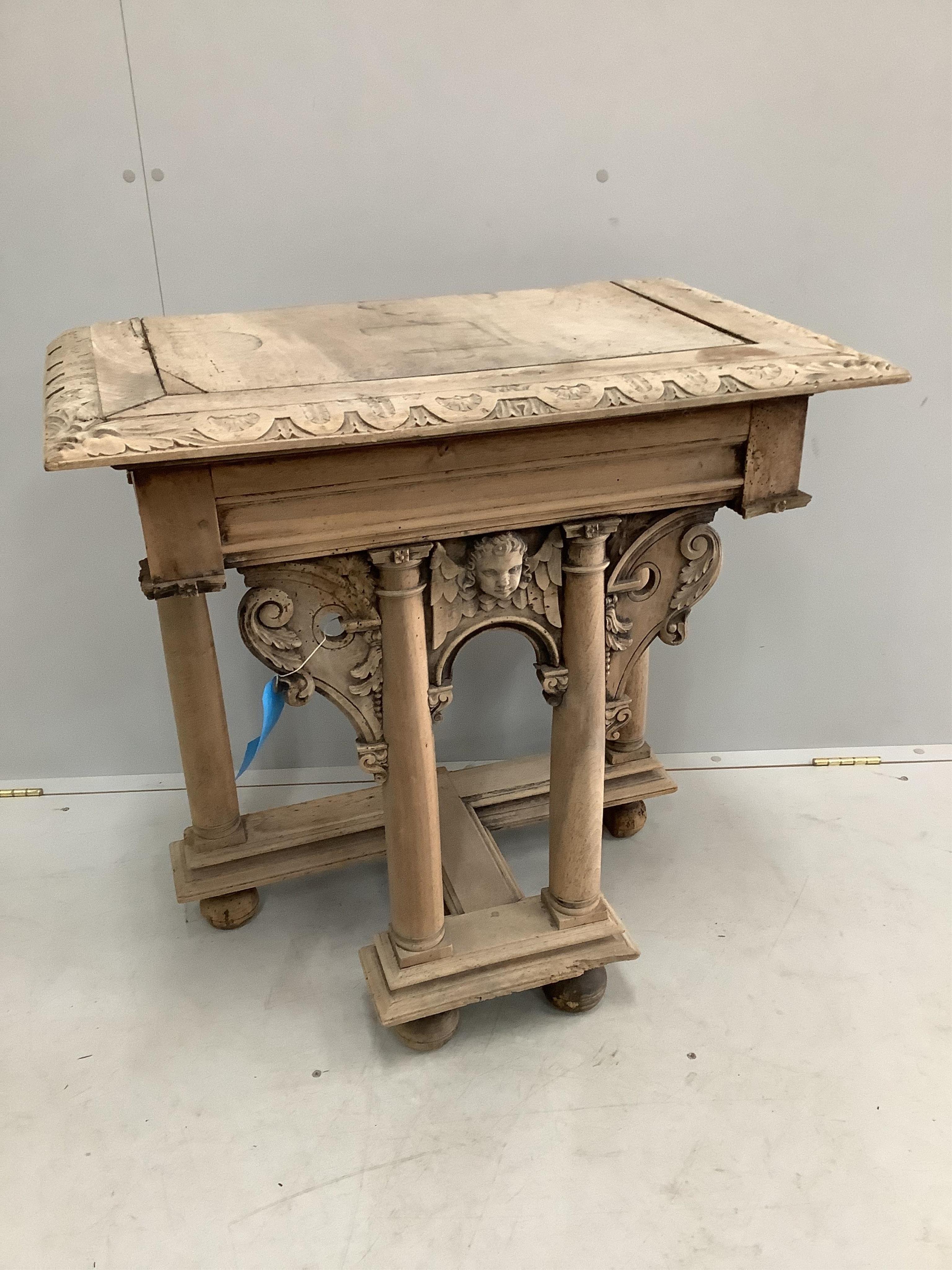 A 19th century limed pine table end, on a carved and turned underframe, width 77cm, depth 46cm, height 79cm. Condition - fair